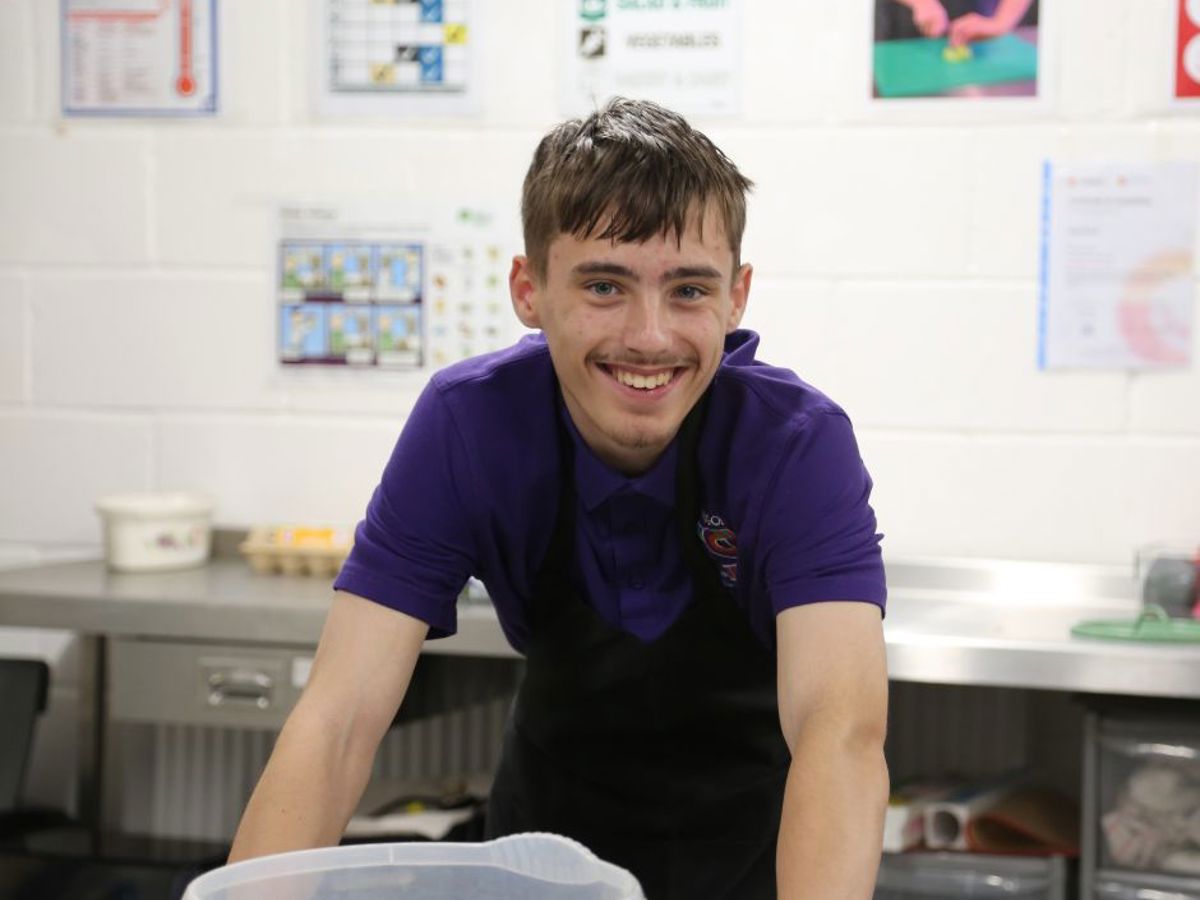 young man in professional kitchen 